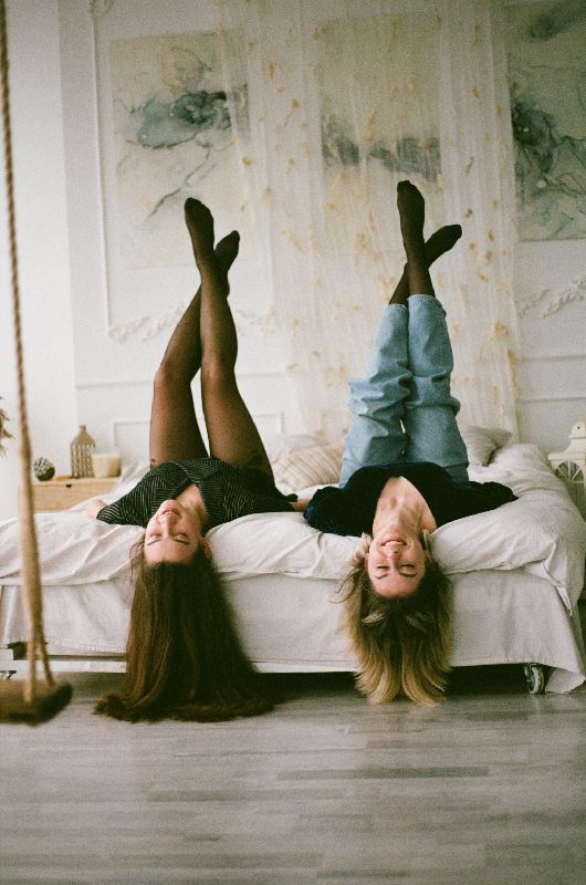 Two Girls Lying Upside Down